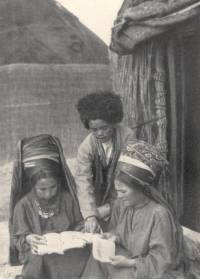 IlliterateTurkoman women marvelling at a book