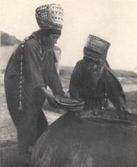 Turkoman women baking in all their finery